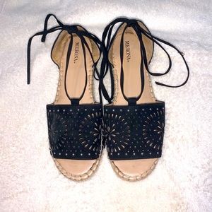 Black sandals with ankle wrap straps